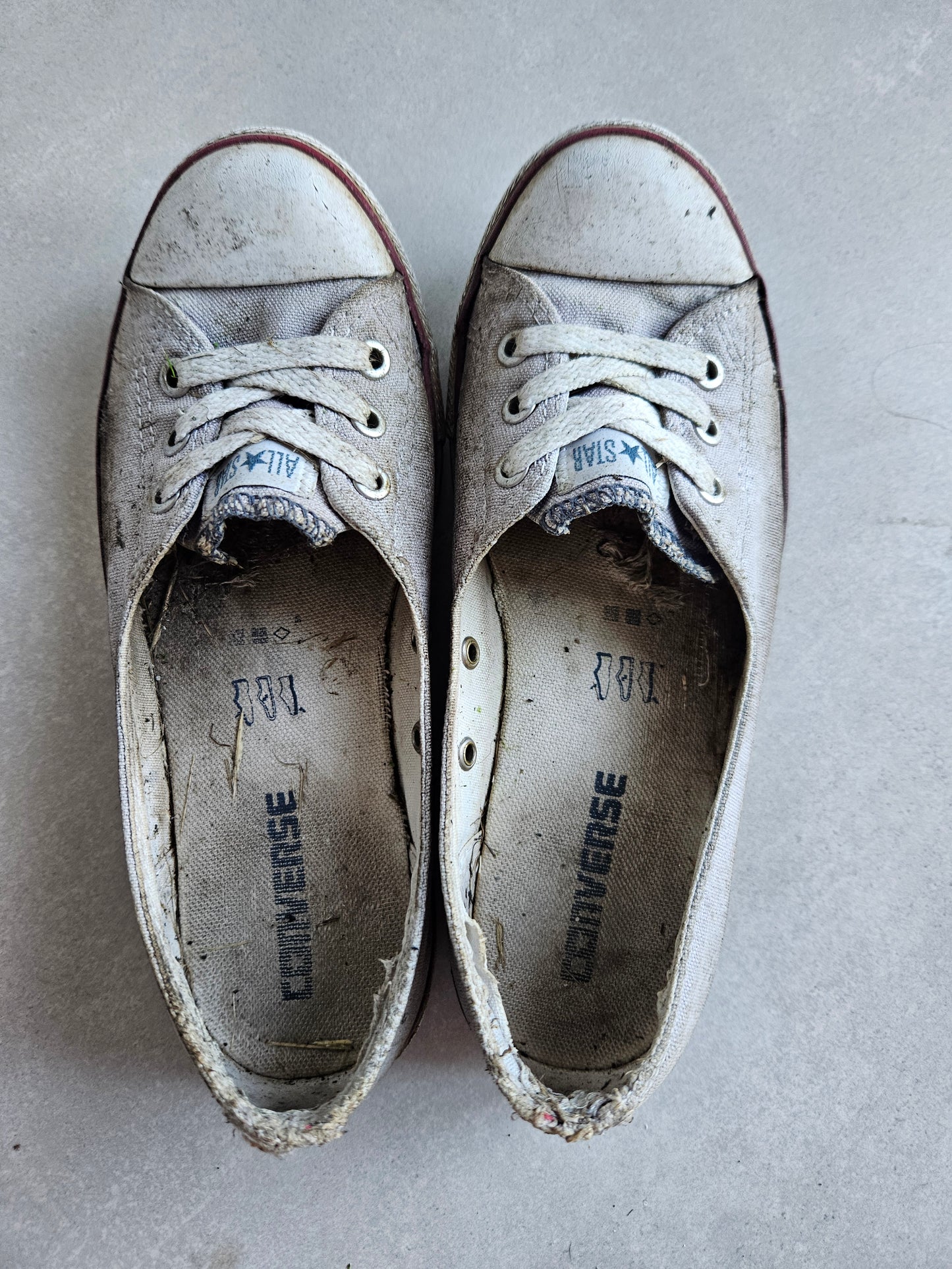 trashed heavily worn smelly shoes